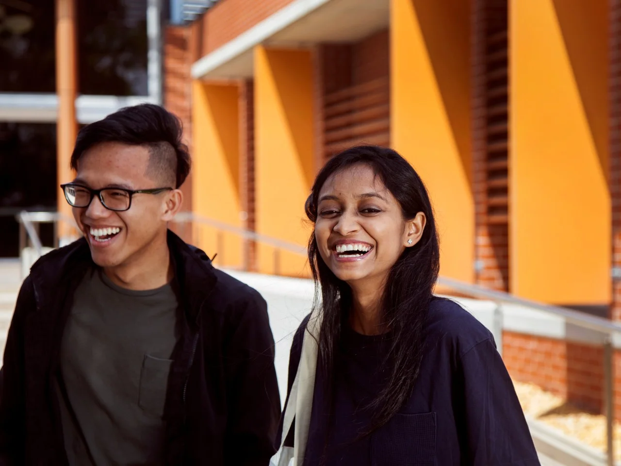 Two students standing on campus