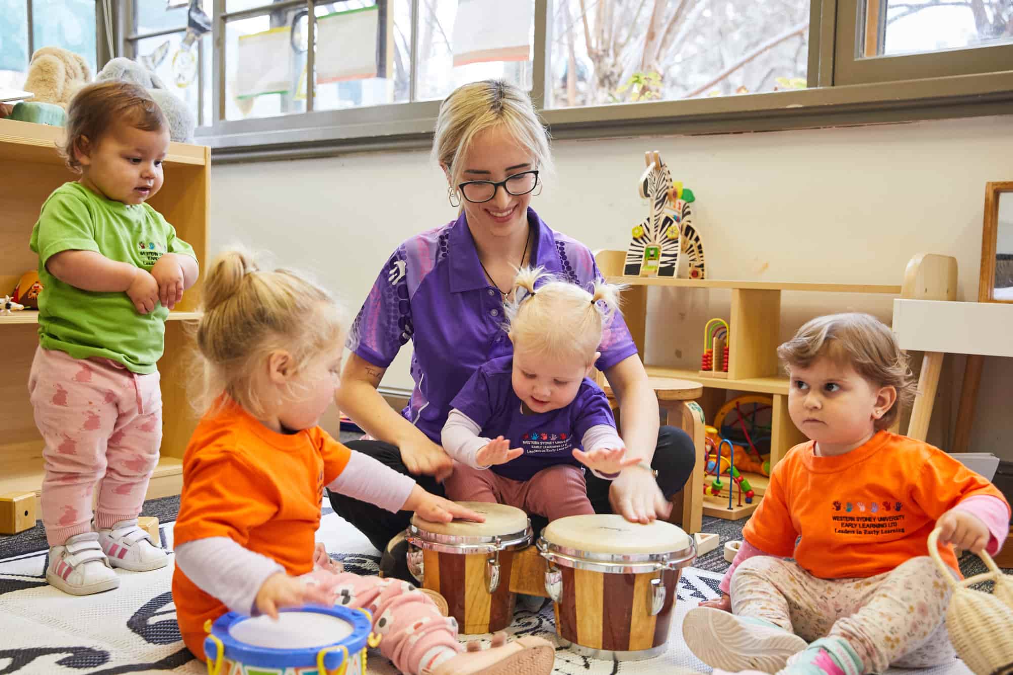 Childcare teacher and children