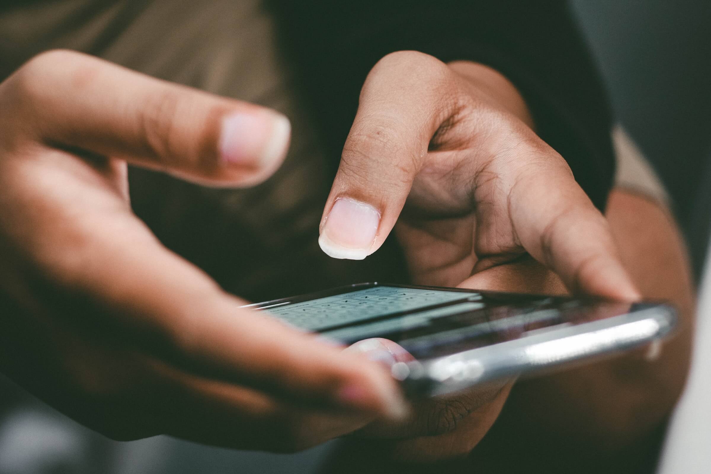 Person with a mobile phone in their hands
