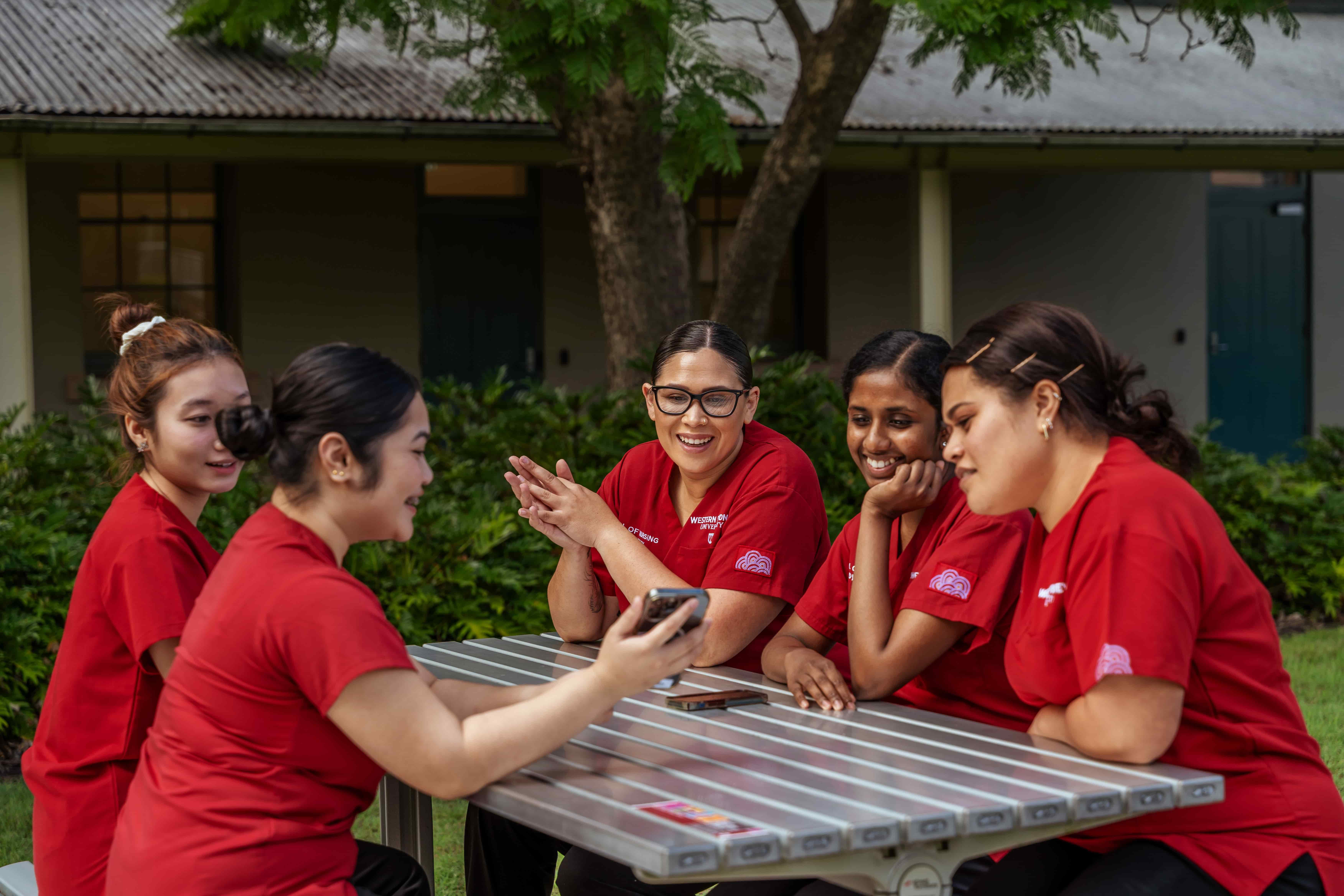 Nursing and Midwifery students on stairs